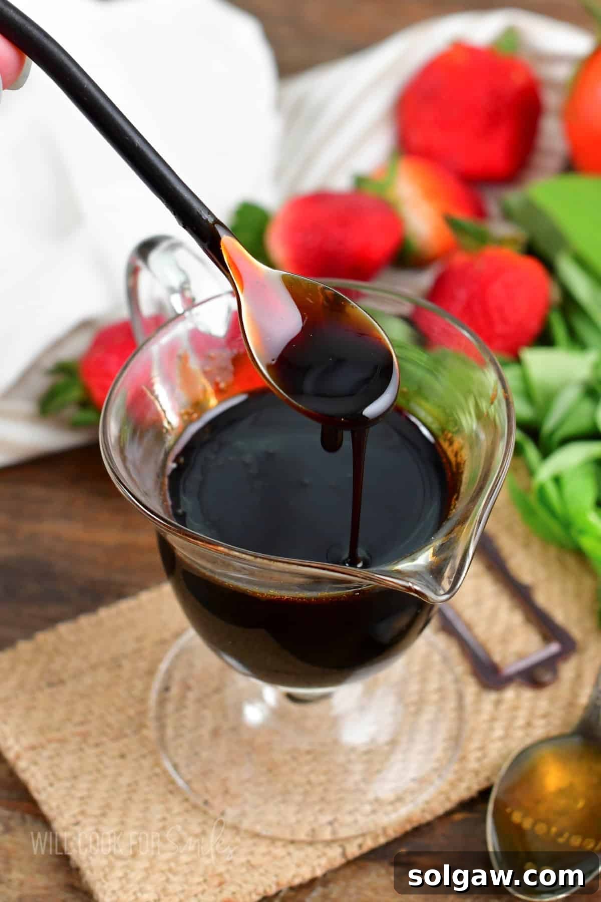 Velvet Balsamic Glaze 2 scooping out some balsamic glaze from the sauce dish and drizzling back in.