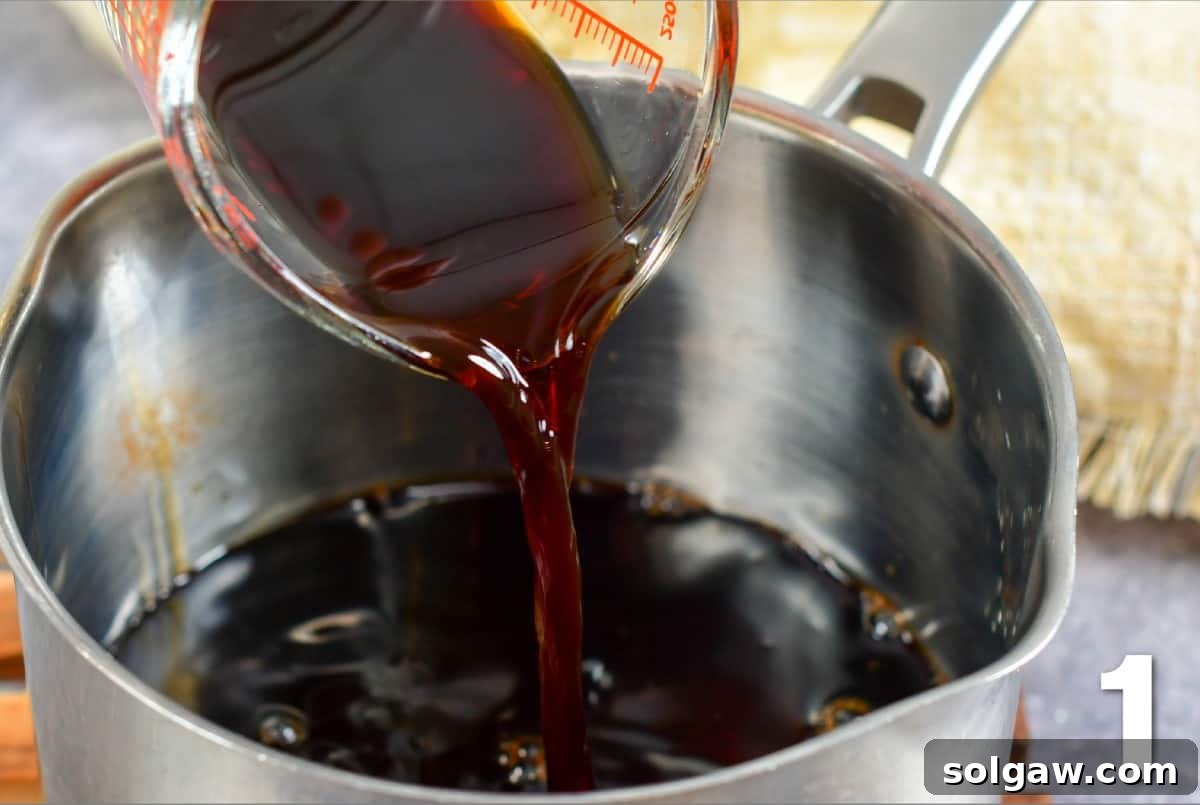 Velvet Balsamic Glaze 4 pouring in balsamic vinegar into the pot with sweetener.