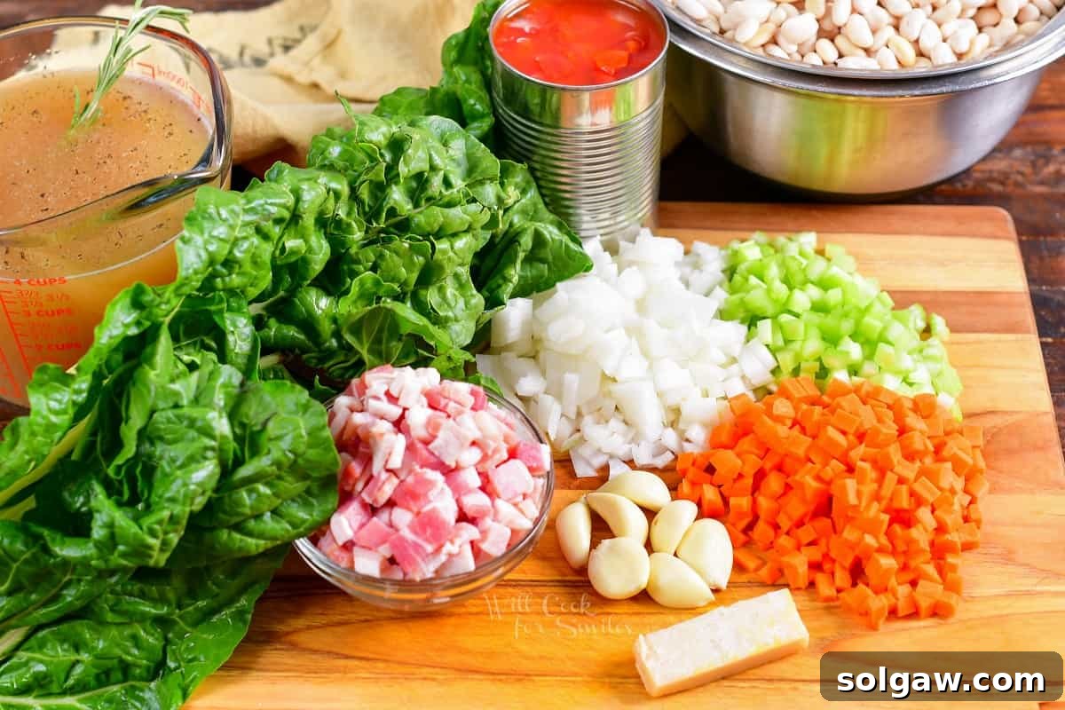 The ingredients for white bean soup are presented on a wooden cutting board. 