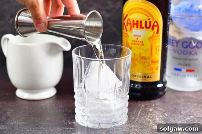 Ice in an old-fashioned glass, ready for cocktail preparation.