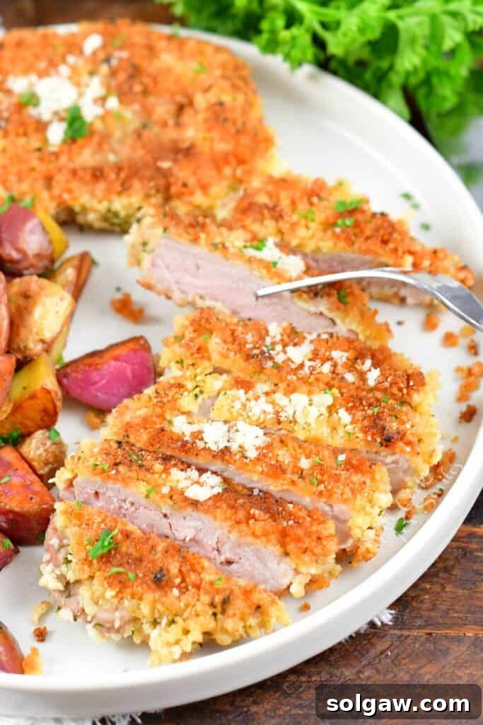 sliced pork cutlet with a fork through one slice