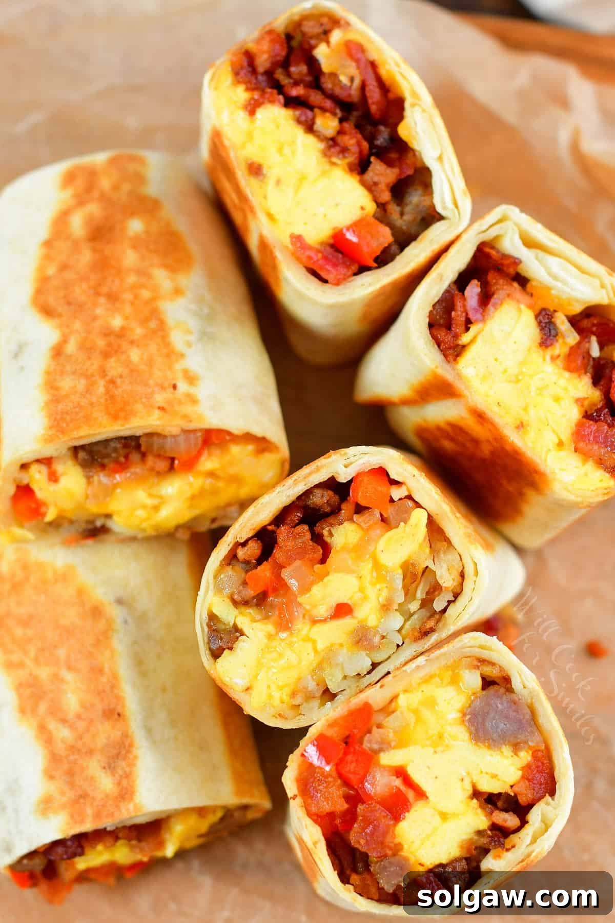 Top view of cut breakfast burritos laying next to each other