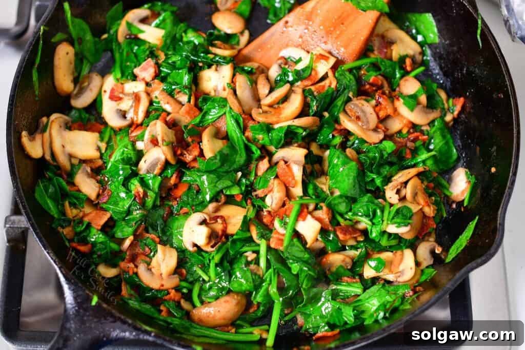 Simple Skillet Frittata 6 spinach bacon and mushrooms sautéed in a skillet