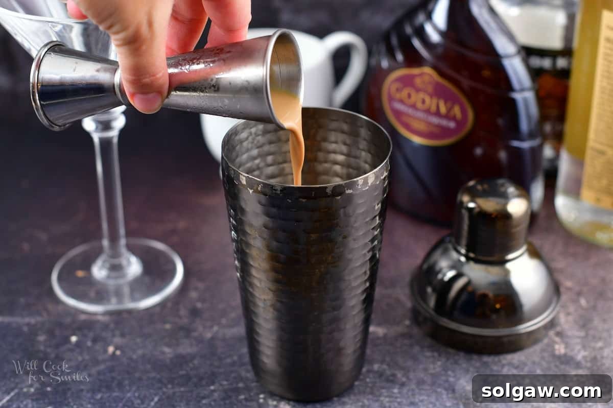 adding chocolate liqueur to the cocktail shaker