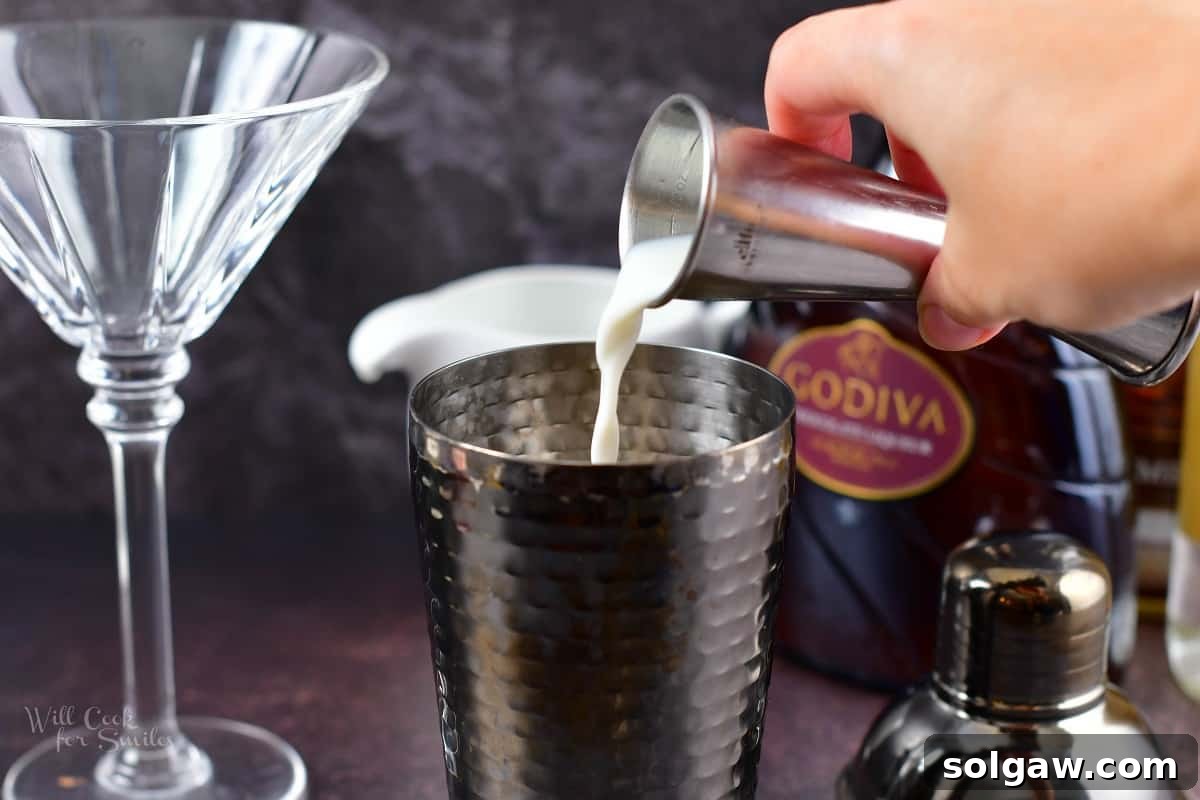 adding milk to the cocktail shaker