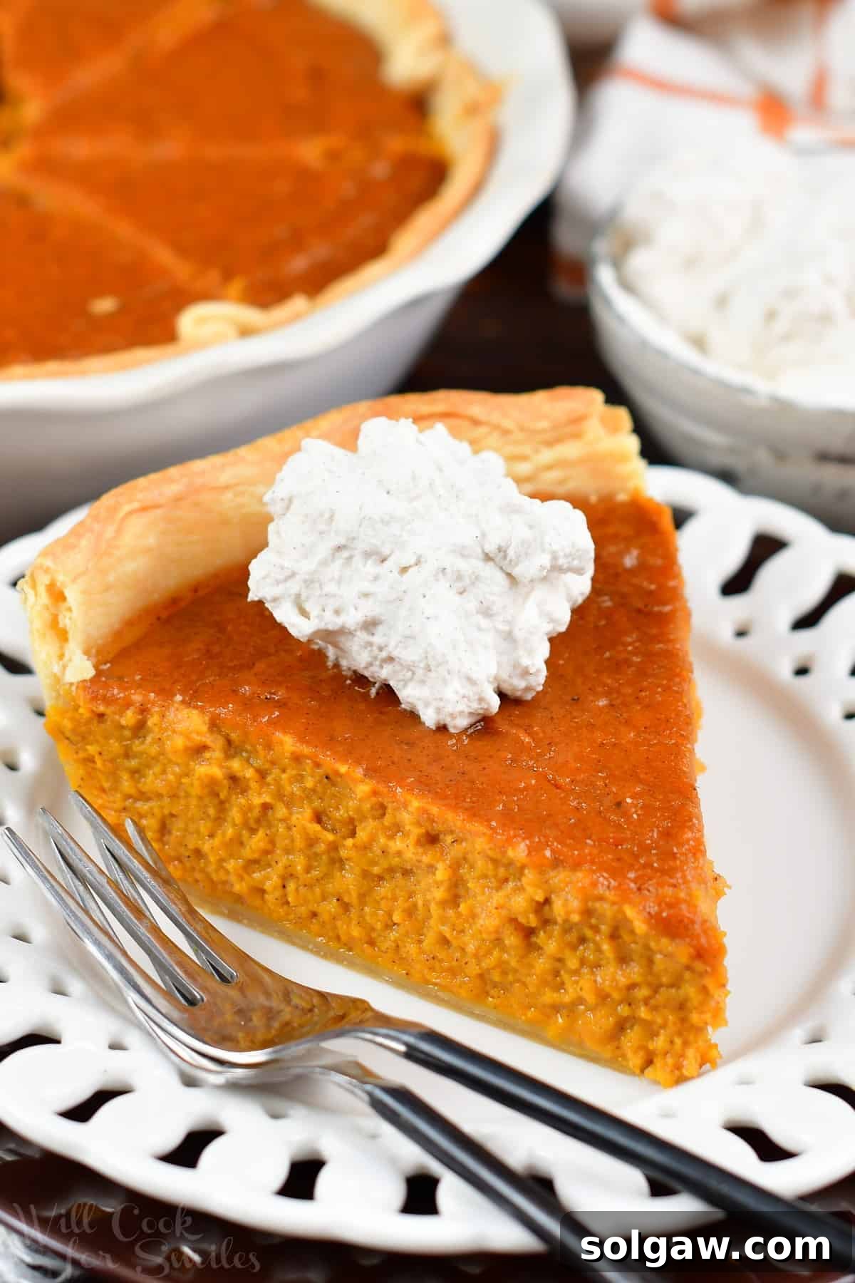 A delectable slice of homemade Sweet Potato Pie, revealing its smooth, creamy texture and golden-brown crust.