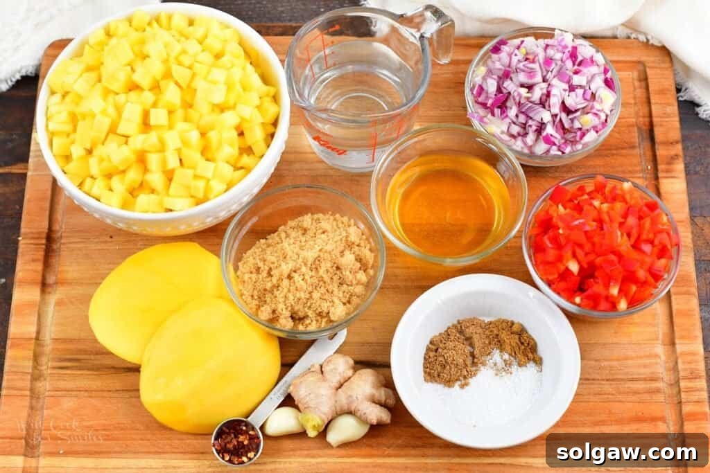 ingredients for mango chutney on a board