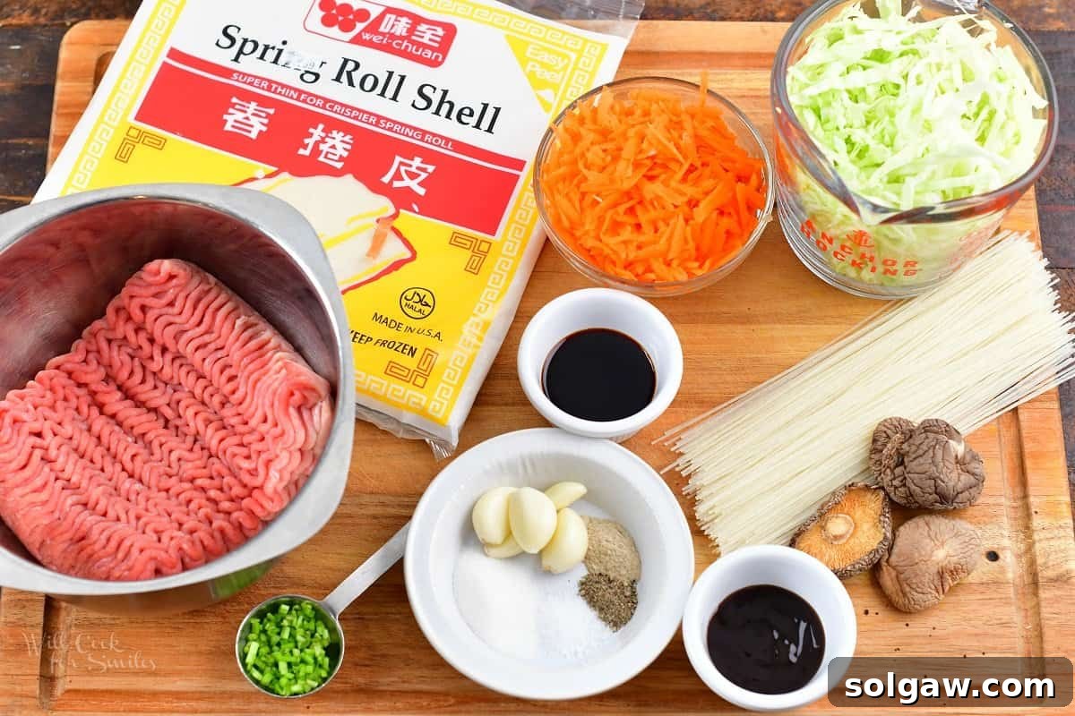 A curated display of fresh ingredients for Thai spring rolls, including shredded cabbage and carrots, dried shiitake mushrooms, glass noodles, ground pork, and various sauces, neatly arranged on a cutting board.