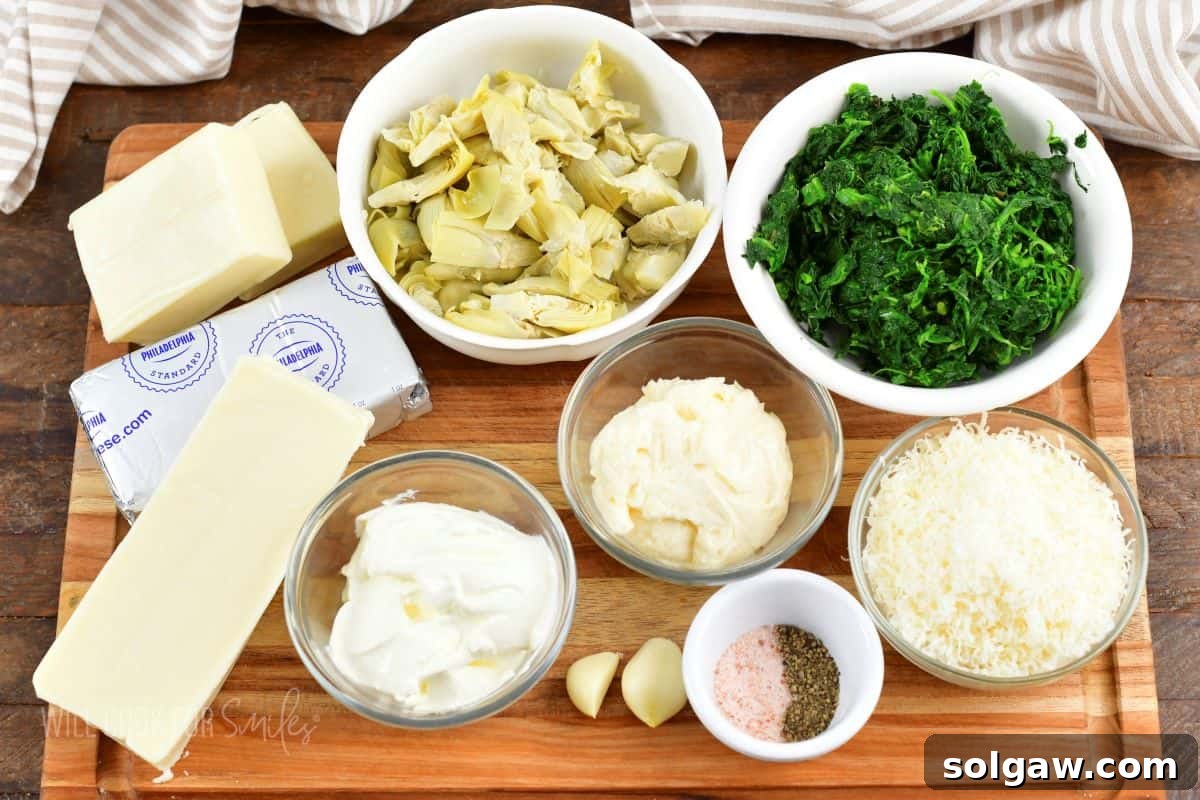 A thoughtfully arranged collection of fresh ingredients for the spinach artichoke dip, including vibrant spinach, tender artichokes, and various cheeses, all laid out on a rustic wooden board.