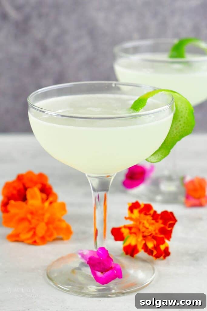 front view of the daiquiri in a tall glass with flowers