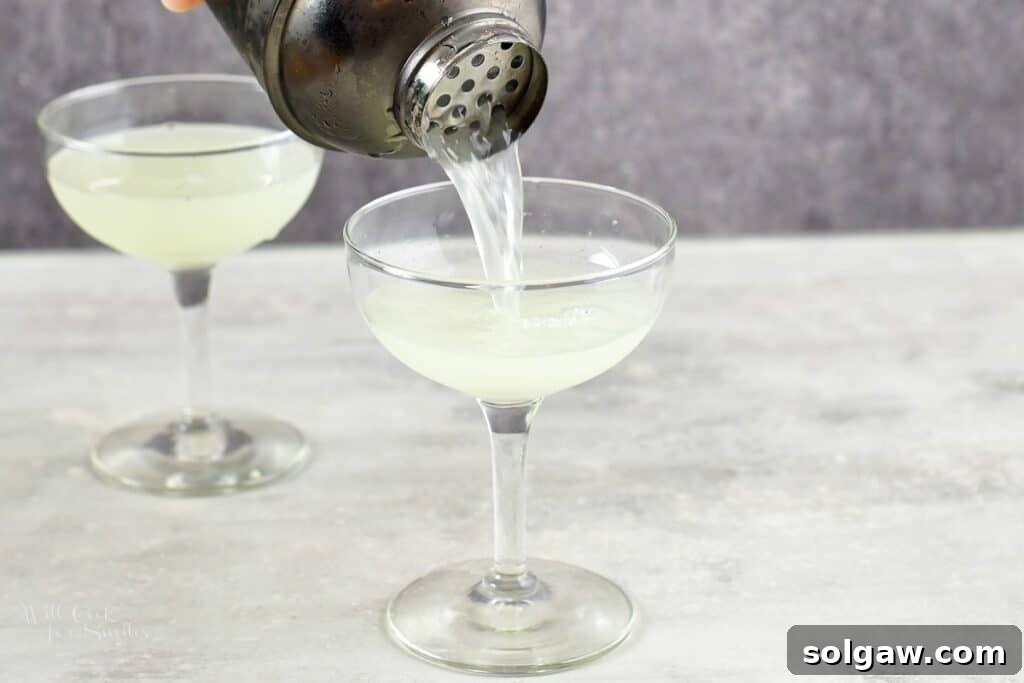 pouring in daiquiri into the glass