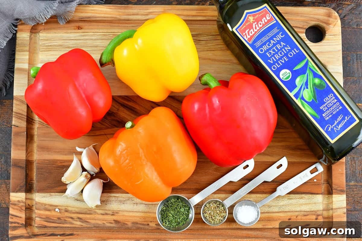 fresh bell peppers and garlic cloves, ingredients for making roasted red peppers