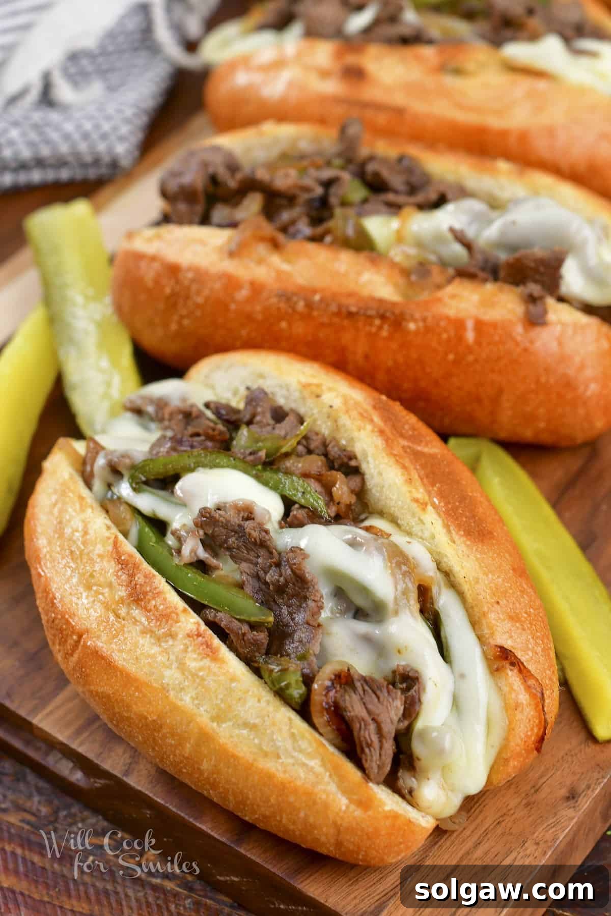 A delicious Philly Cheesesteak sandwich, golden brown and overflowing with steak, onions, and melted cheese, ready to be enjoyed.