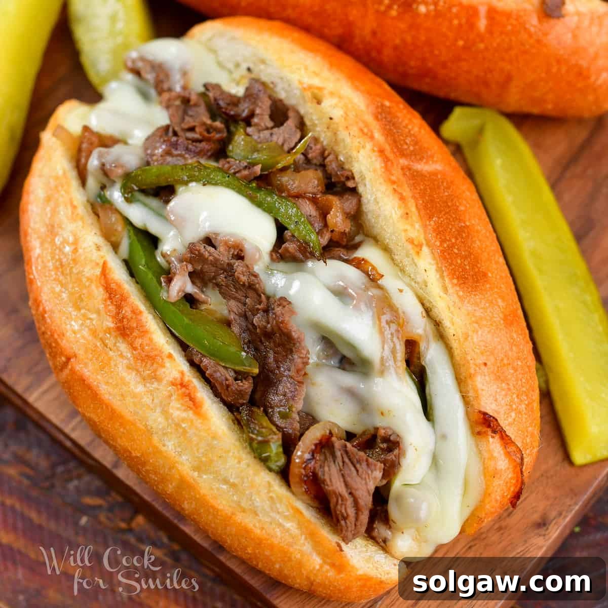 A close-up image of a single, perfectly crafted Philly Cheesesteak sandwich, showcasing its delicious filling.