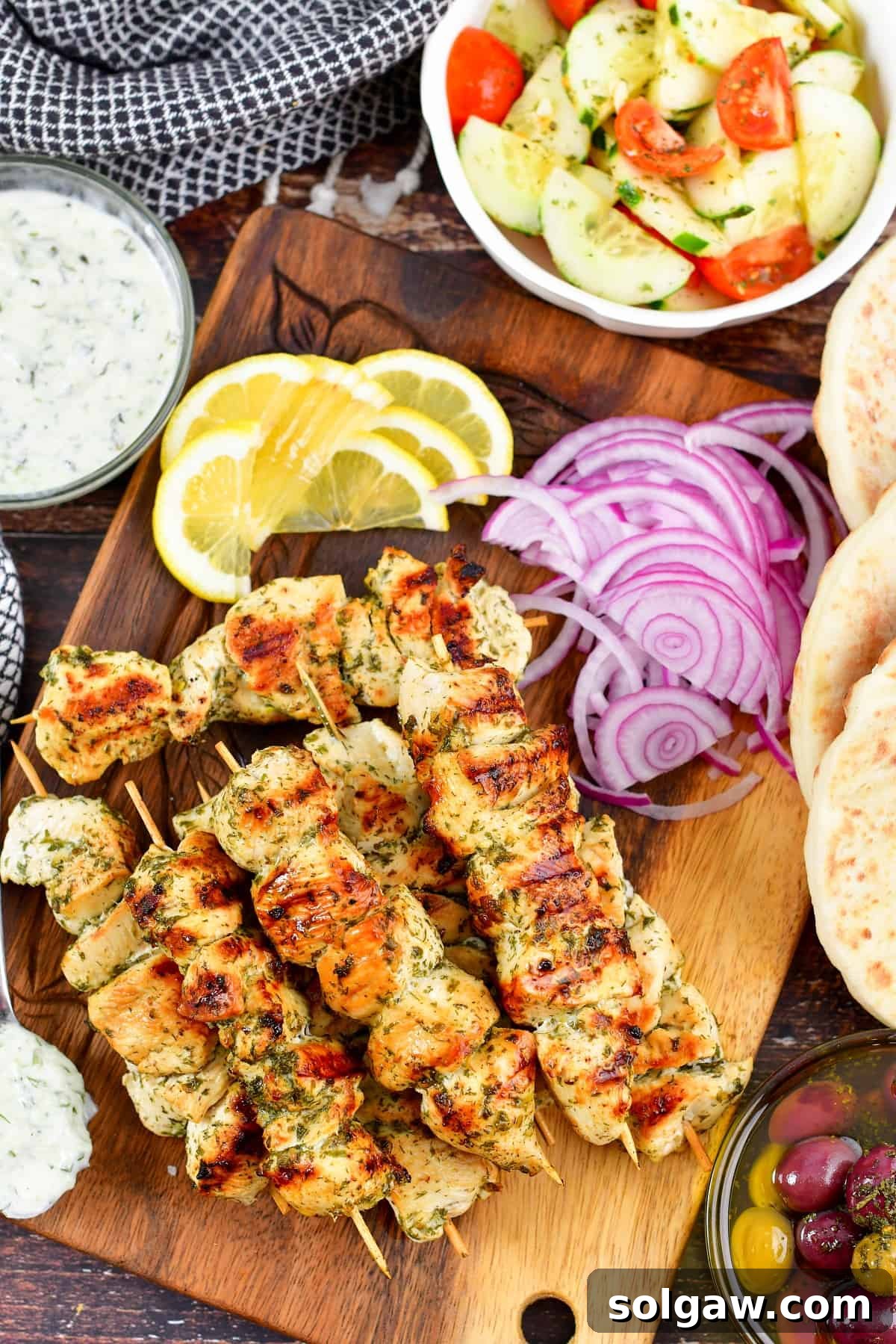 Chicken Souvlaki: Grill or Pan-Fry Your Way to Perfection 7 top view of chicken skewers and all the toppings