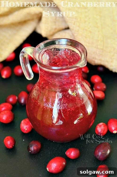 Cranberry Syrup in a glass pitcher