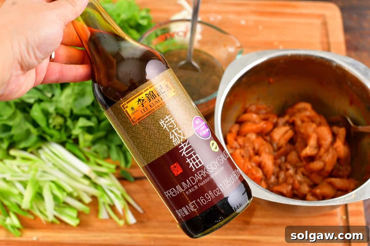 A bottle of dark soy sauce, an essential ingredient for authentic Pad See Ew.