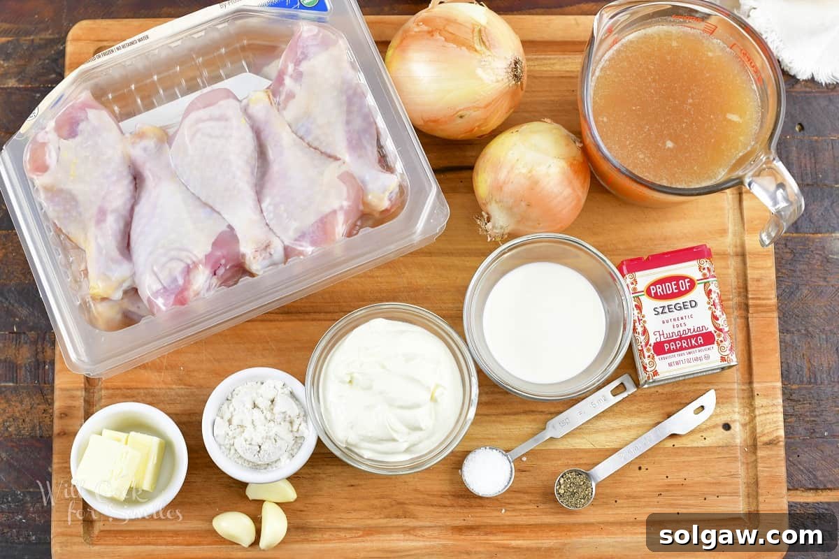 ingredients to make chicken paprikash on the board