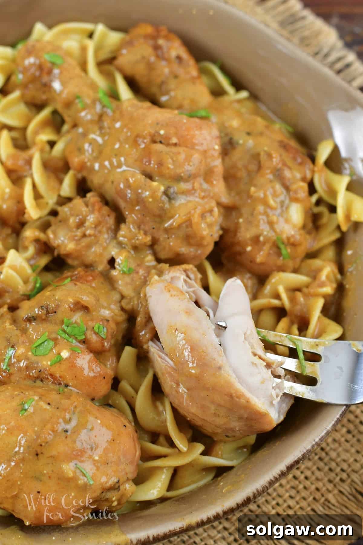 taking off a pieces of chicken from the drumstick