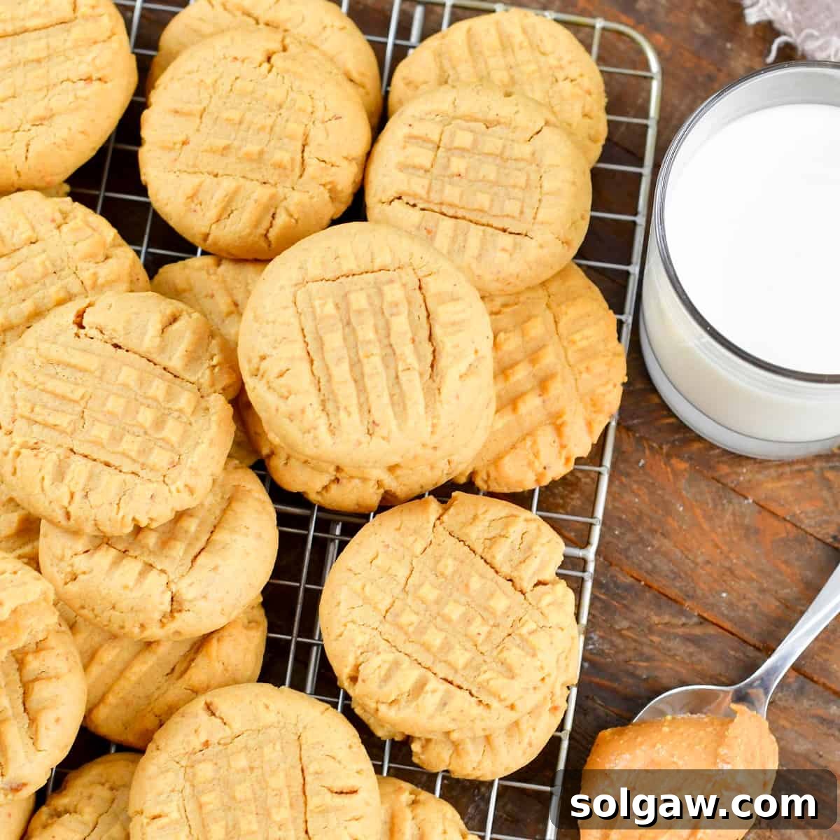 squared closeup of peanut butter cookies and milk.