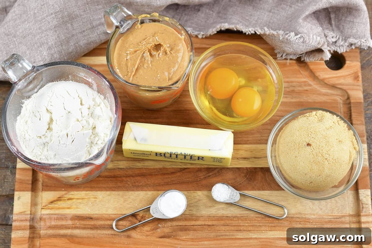 ingredients for the peanut butter cookies on the board.