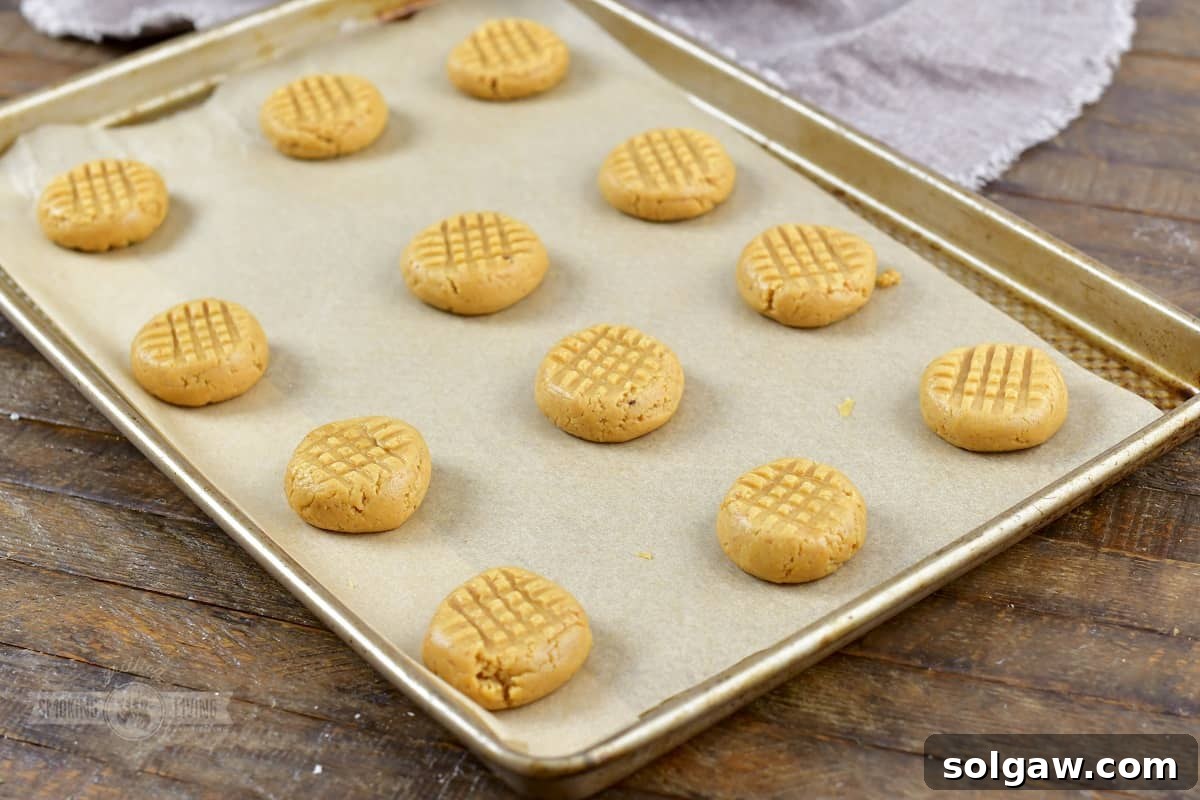 pressed cookies on the baking sheet before baking.