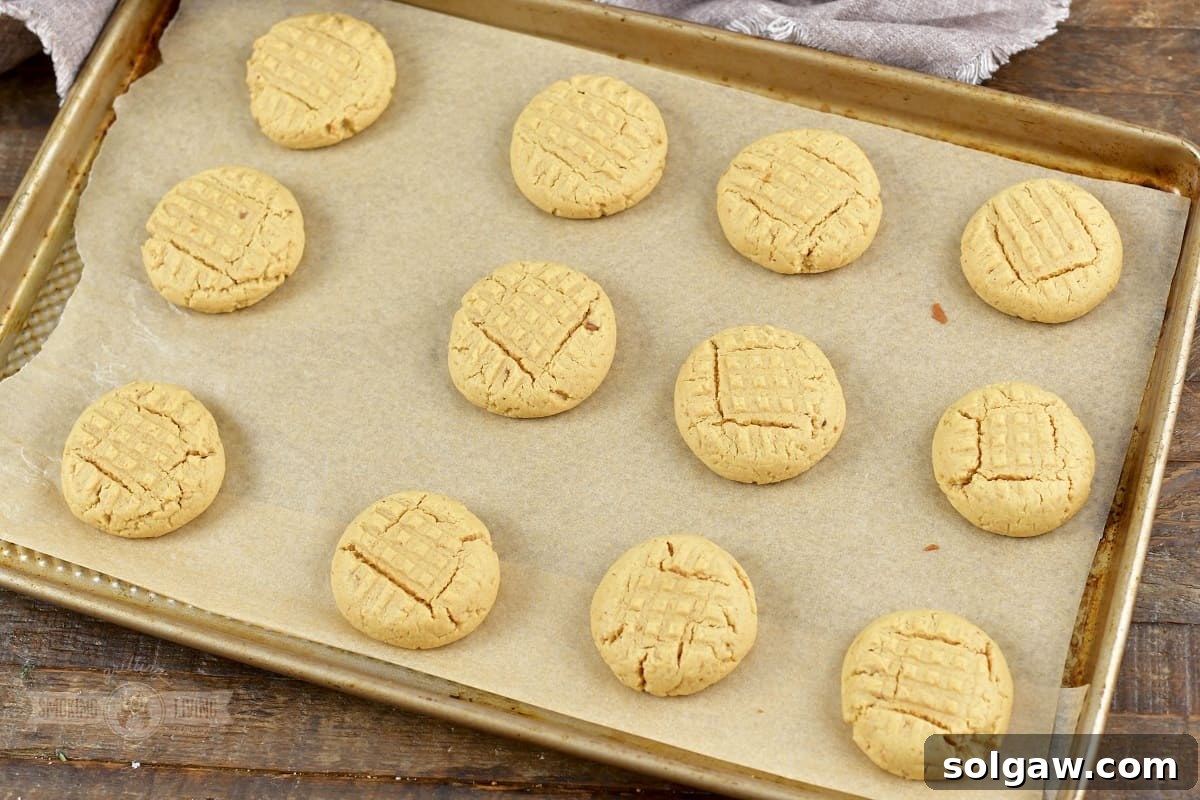 baked peanut butter cookies of the baking sheet.