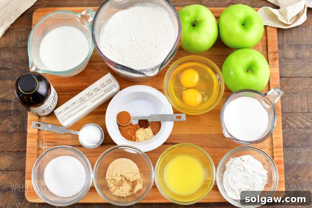 A collection of fresh, vibrant ingredients for the Irish apple cake, including apples, flour, sugar, and spices, beautifully arranged on a wooden cutting board.