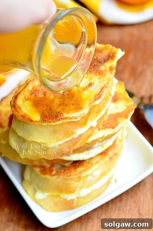 pouring syrup over Orange Creamsicle French Toast