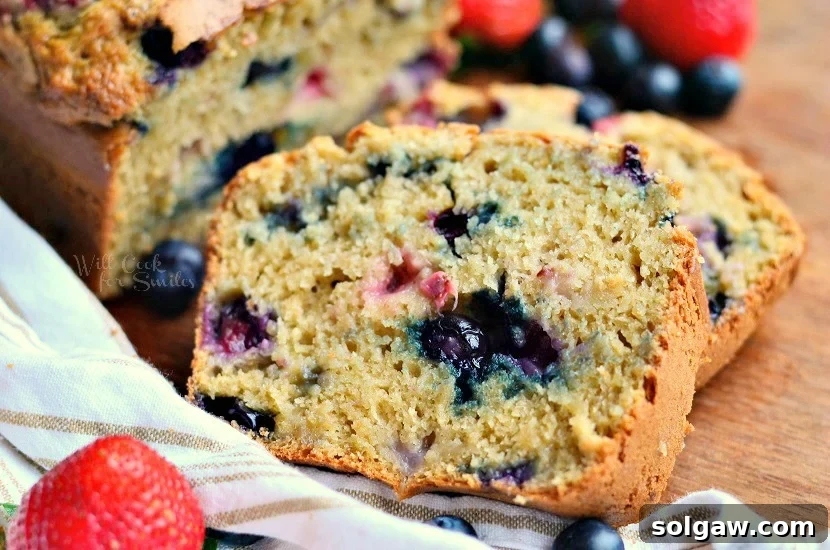 slices of berry bread with strawberry and blueberries