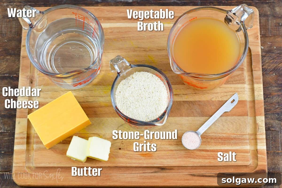 Infographic displaying fresh ingredients for cheese grits on a wooden cutting board: stone-ground grits, water, broth, butter, and sharp cheddar cheese.
