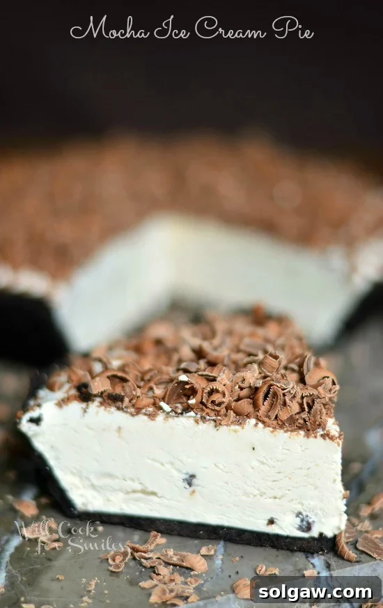 Mocha Ice Cream Pie, a cream pie made with iced coffee, mini chocolate morsels, topped with shaved milk chocolate and it's frozen