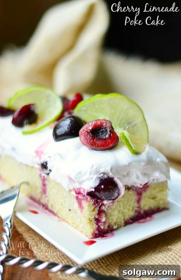 Cherry Limeade Poke Cake on a plate