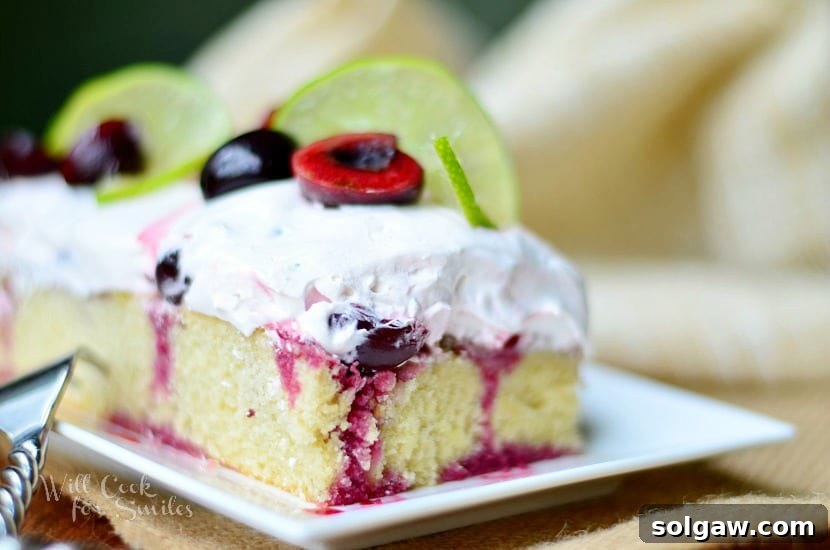 Cherry Limeade Poke Cake on a plate