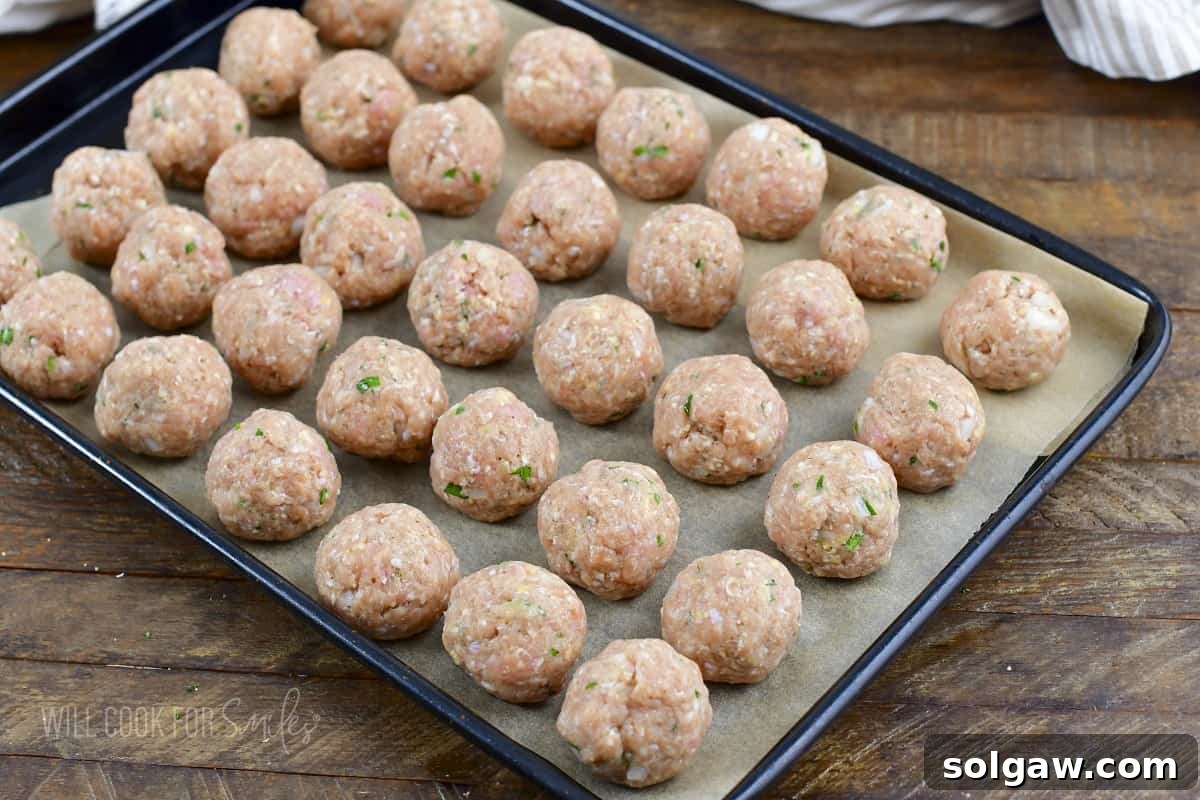 rolled turkey meatballs on the baking sheet.