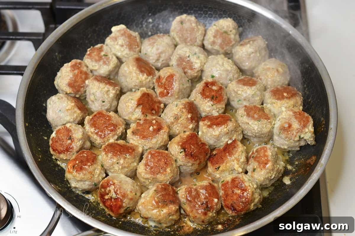 cooking turkey meatballs in the cooking pan.