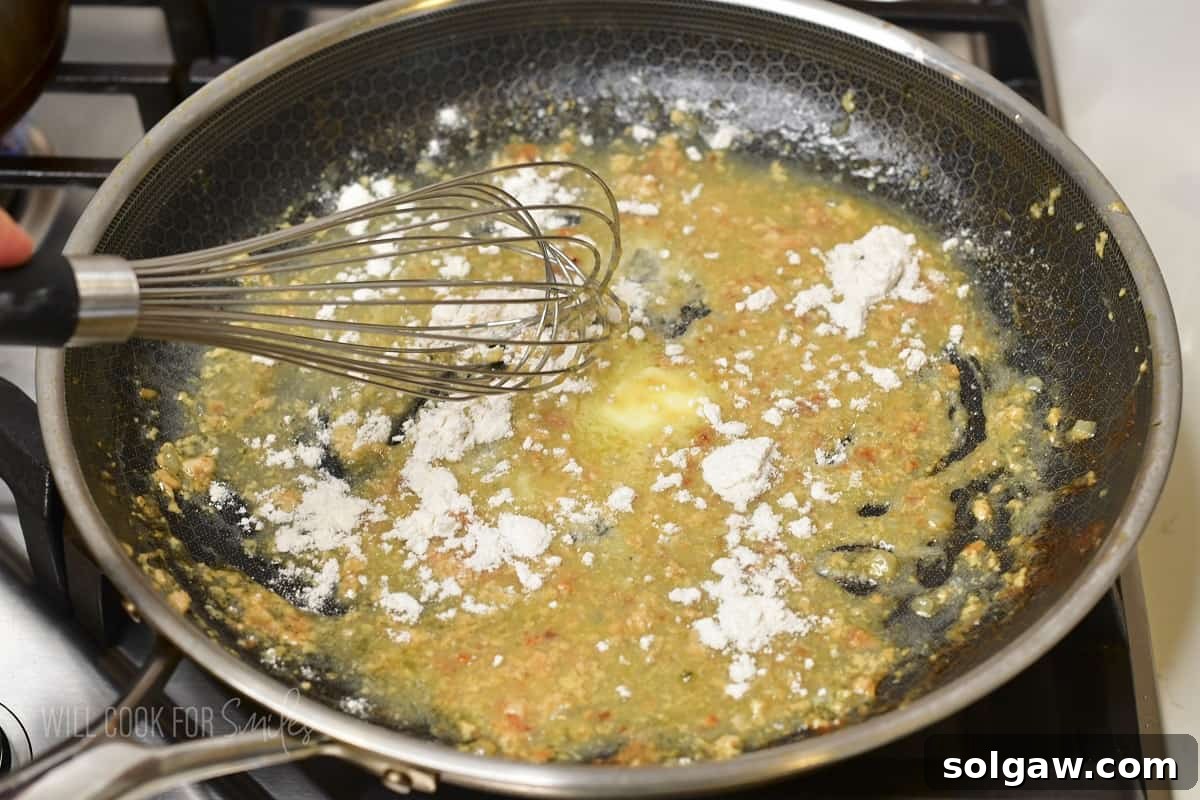 whisking in flour into butter and meatball juices.