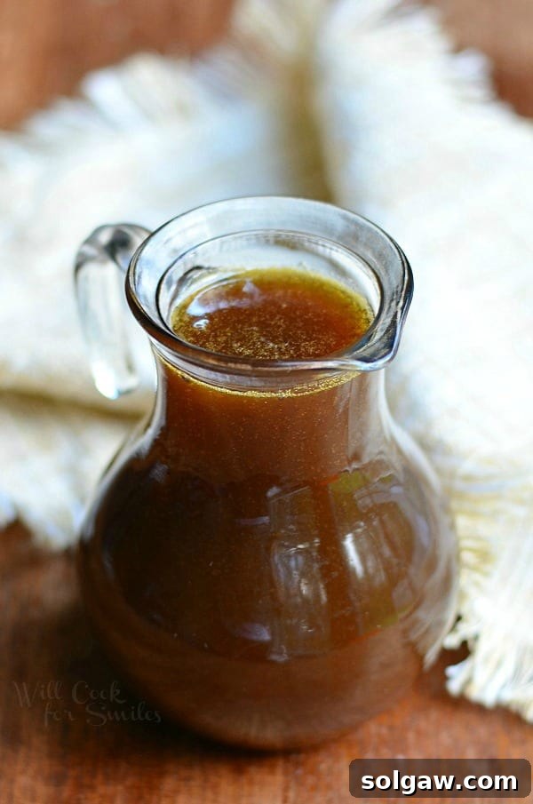 A final image showing a beautifully styled fall breakfast spread featuring Homemade Pumpkin Syrup with pancakes, emphasizing the comfort of the season.