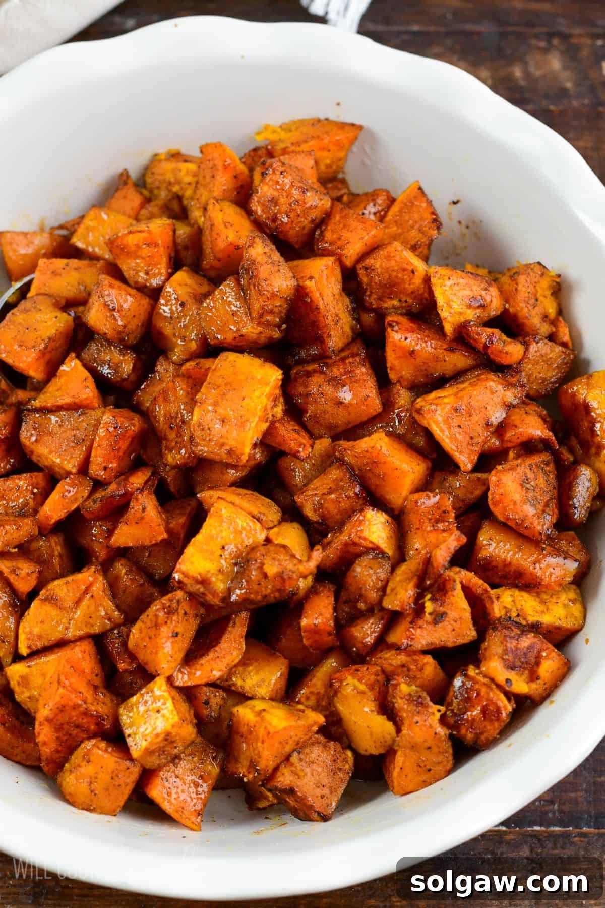 Cooked spiced roasted honeynut squash in a large bowl.