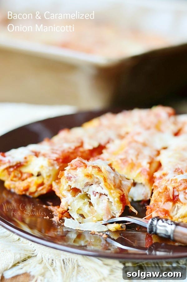 Platter of Bacon & Caramelized Onion Manicotti, ready to be served as a delightful Italian dinner.