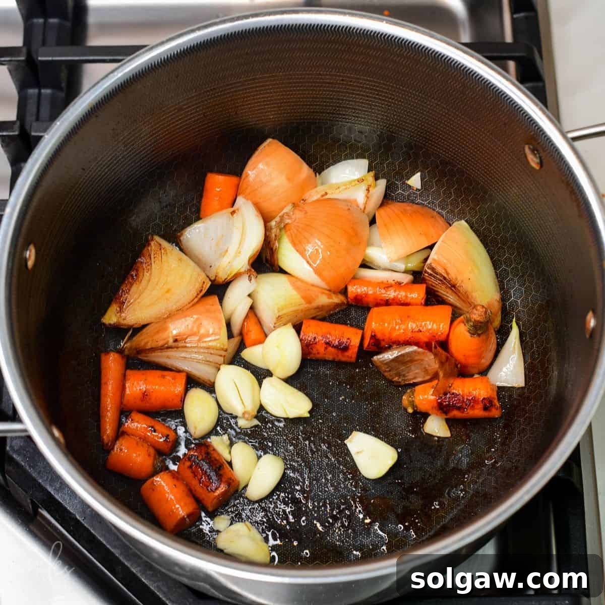 searing quartered onions and carrots, and garlic for the beef broth.