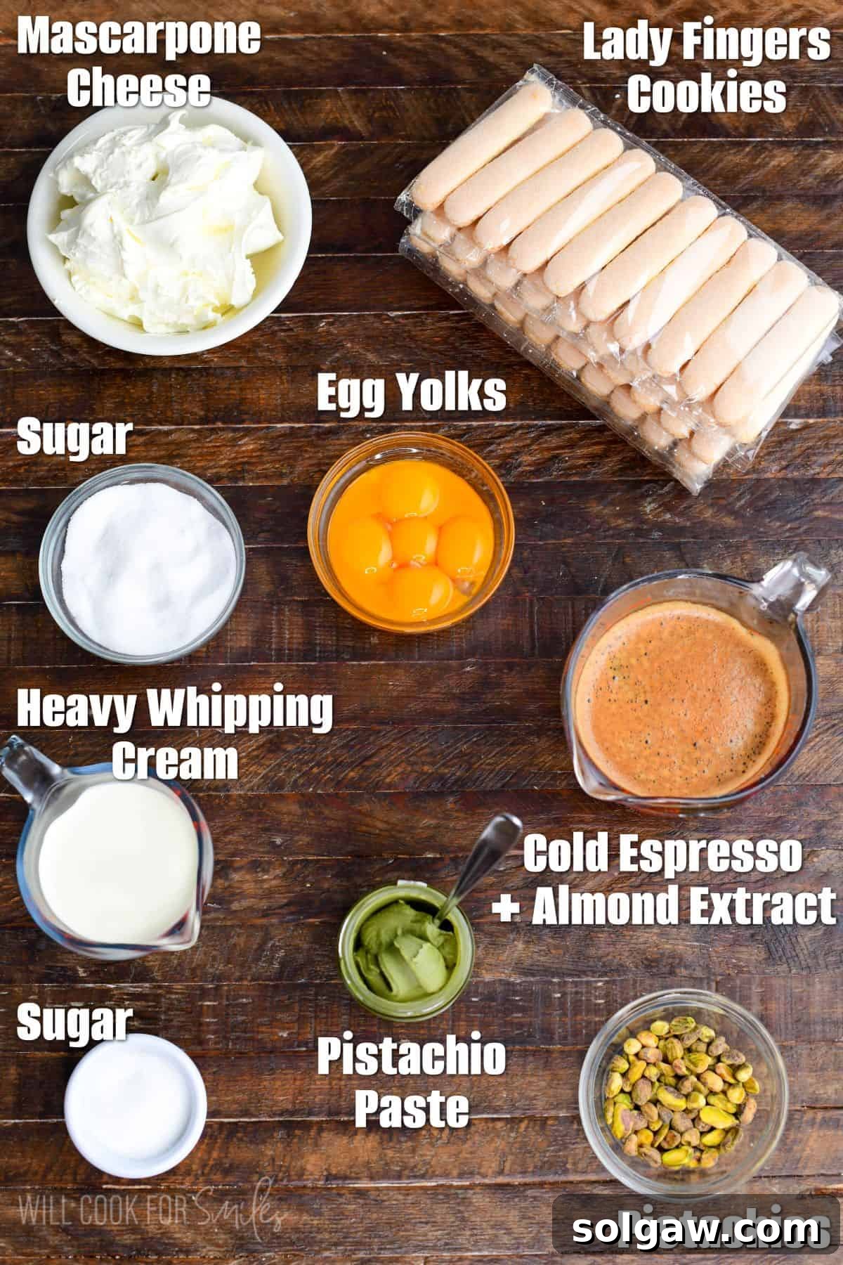 Velvet Pistachio Tiramisu 3 Labeled ingredients for pistachio tiramisu on a wood surface.