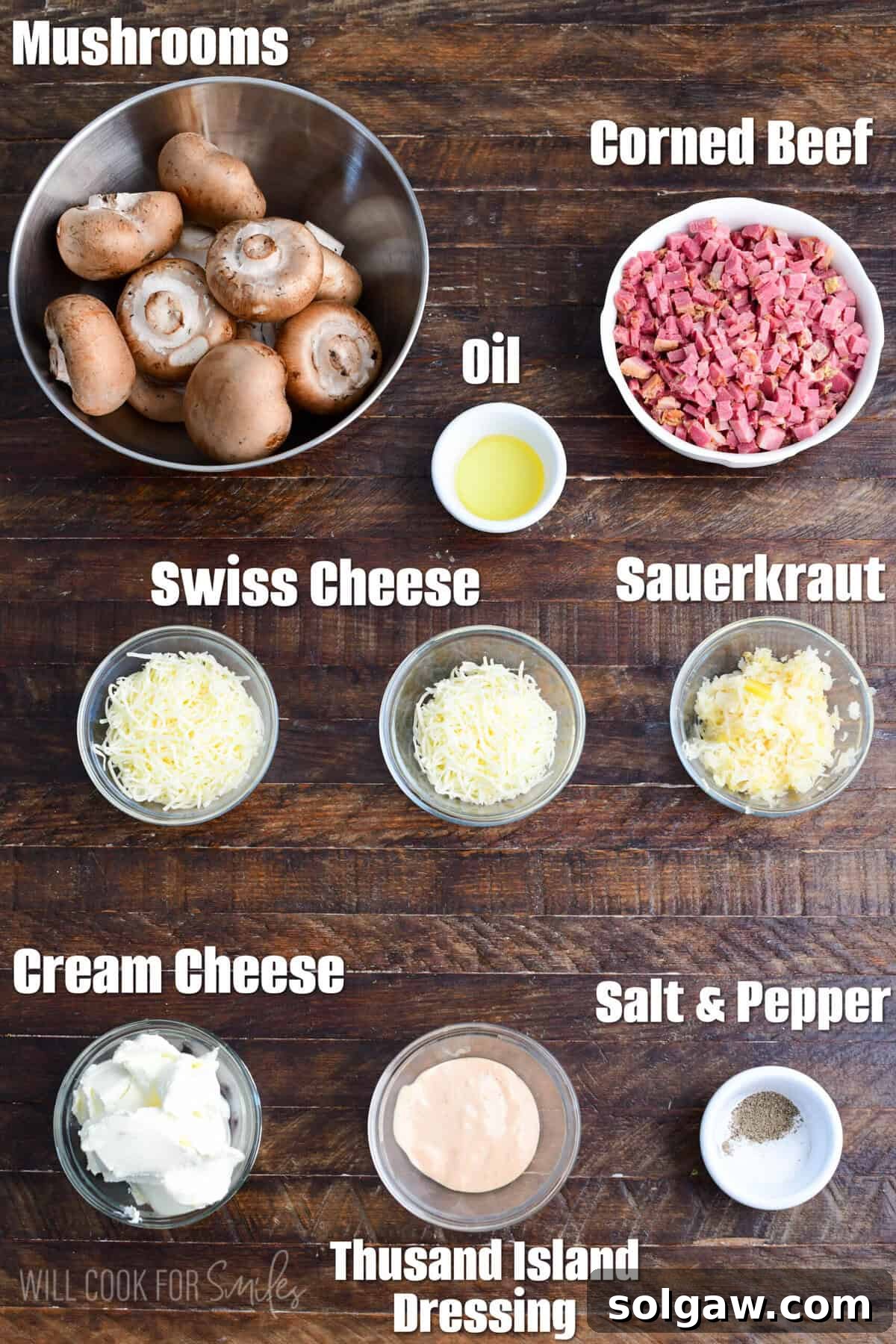 labeled ingredients for Reuben stuffed mushrooms on a wooden board.
