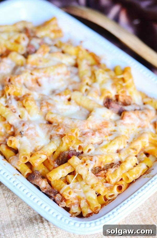 A generous serving of Italian Cheesesteak Baked Ziti on a plate, showcasing the layers of pasta, steak, and melted cheese.