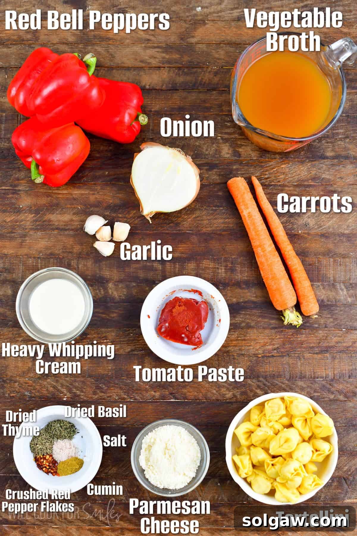 Velvety Roasted Red Pepper Tortellini Soup 3 A perfectly arranged wooden board showcasing the essential ingredients for roasted red pepper soup, ready for preparation.