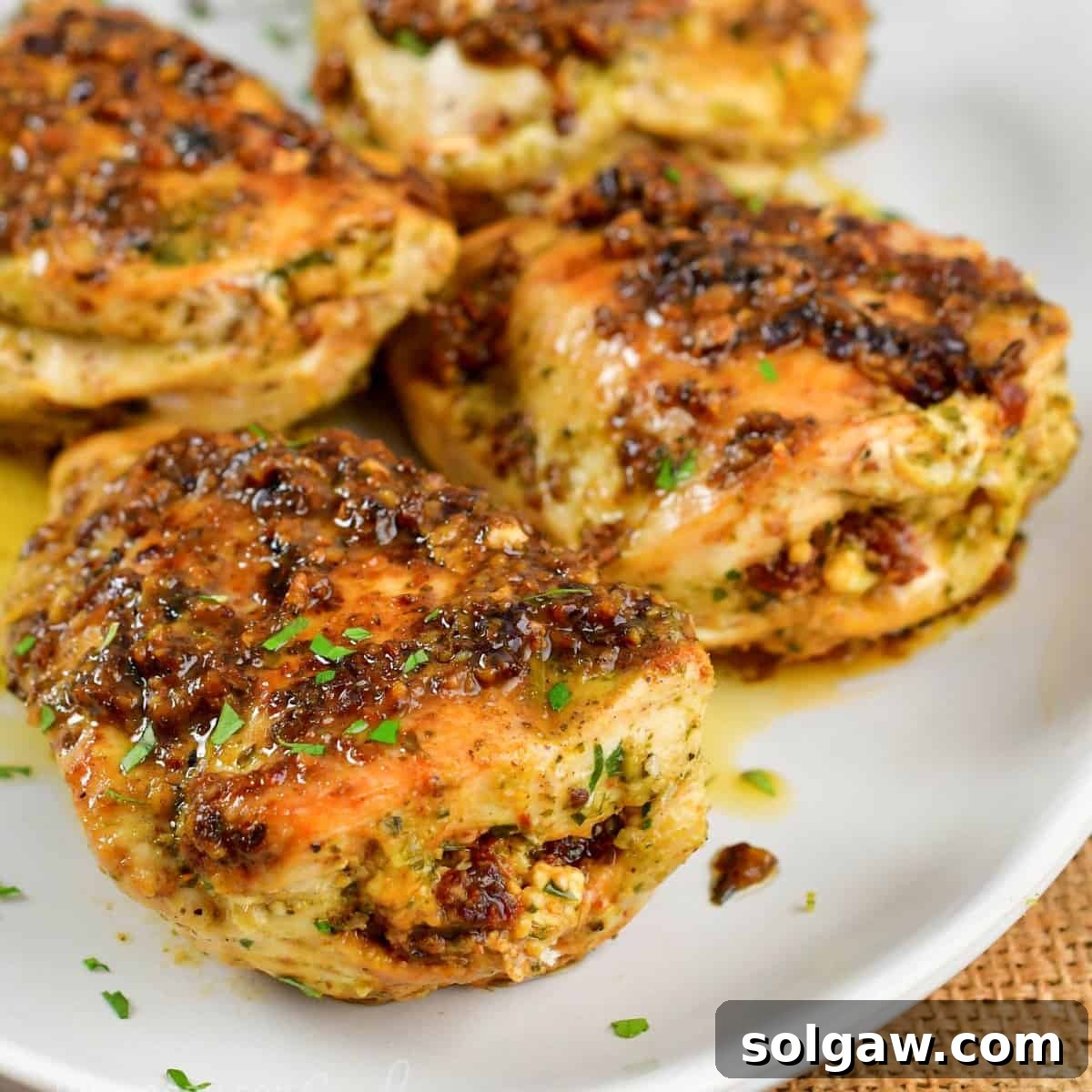 Feta Sun-Kissed Chicken 9 closeup of stuffed chicken with pesto, sun dried tomatoes and feta.