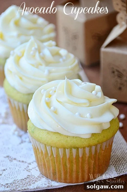 Golden Avocado Cupcakes crowned with light Cream Cheese Frosting.