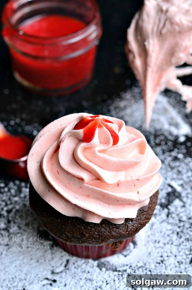 A beautiful swirl of homemade Strawberry Buttercream Frosting, perfect for any celebration.
