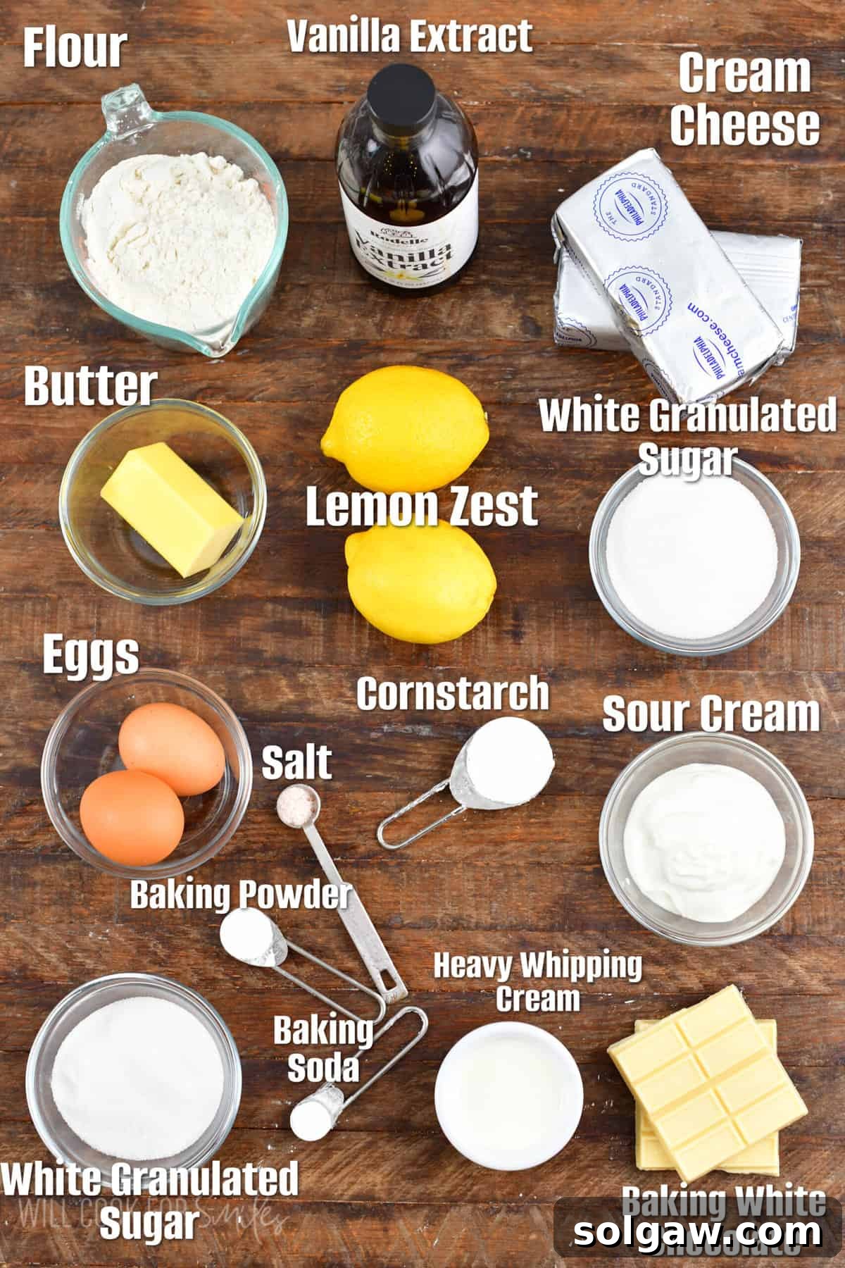 A collection of perfectly labeled ingredients laid out on a rustic wooden surface, ready to be transformed into delicious lemon cheesecake cookie bars.