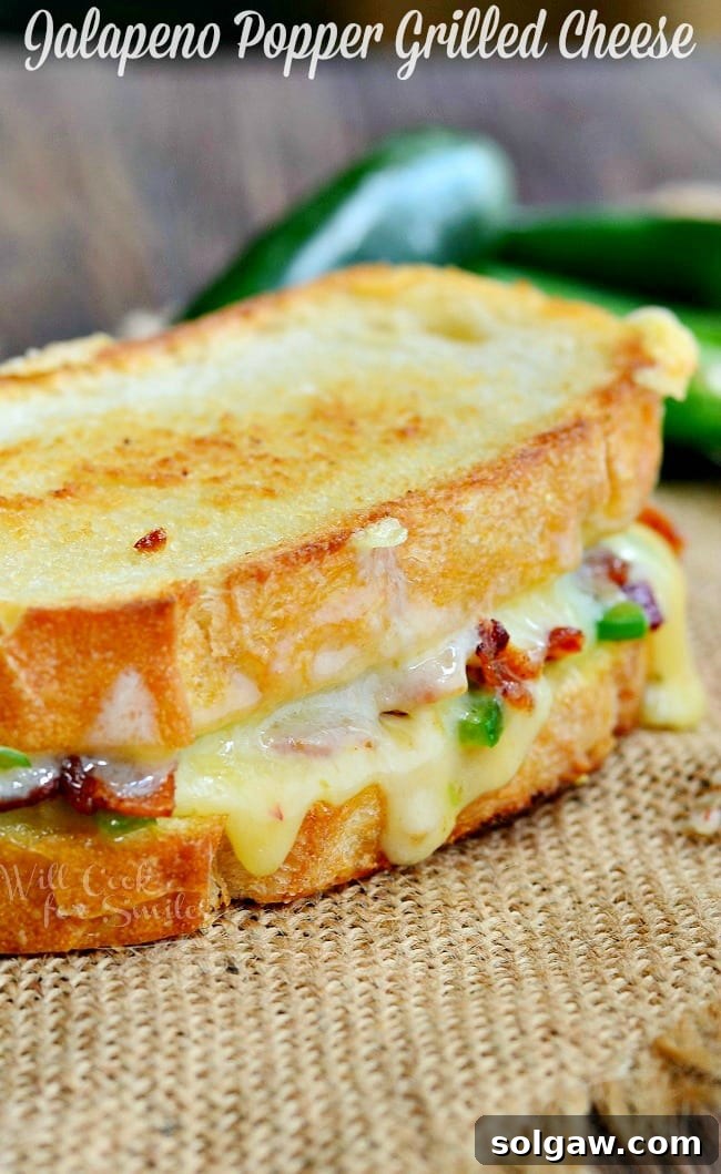 Jalapeno Popper Grilled Cheese loaded with gooey cheese, jalapenos and bacon 
